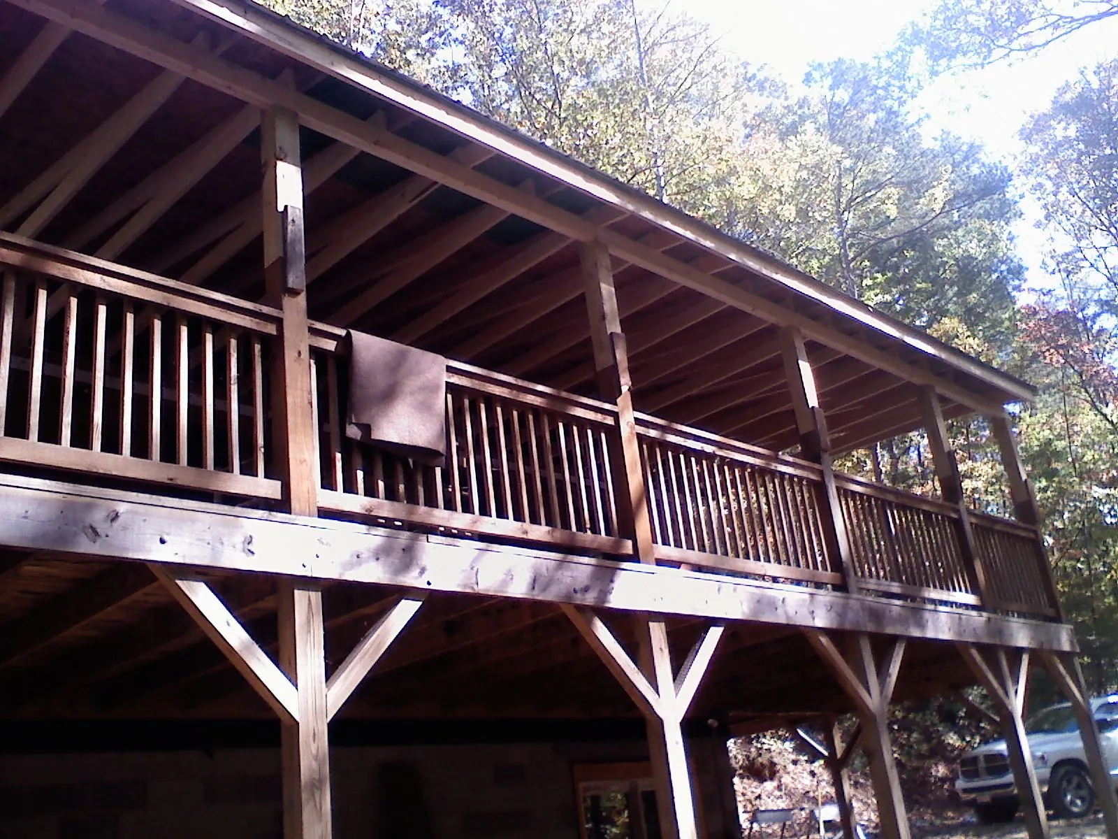 Timber framing under a new elevated porch and deck — Roof Leak Repair in Huson by Roofing Brothers